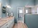 Bright bathroom featuring double vanity and a glass shower at 20744 Queen Alexandra Dr, Leesburg, FL 34748