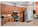 Beautiful kitchen featuring granite countertops, stainless steel appliances, and wood cabinets at 20744 Queen Alexandra Dr, Leesburg, FL 34748