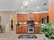 Stunning kitchen featuring granite countertops, stainless steel appliances, and wood cabinets at 20744 Queen Alexandra Dr, Leesburg, FL 34748