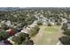 Aerial view of home and community, highlighting its location near a golf course at 2211 Stonebridge Way, Clermont, FL 34711