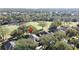 Aerial view showcasing home's location in a quiet community near a golf course at 2211 Stonebridge Way, Clermont, FL 34711