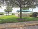 Relaxing gazebo overlooking a scenic lake view at 2211 Stonebridge Way, Clermont, FL 34711