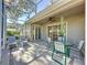 Screened patio with seating area and table at 2211 Stonebridge Way, Clermont, FL 34711