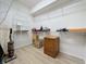 Storage room with wire shelving and wooden cabinet at 2211 Stonebridge Way, Clermont, FL 34711