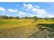 Expansive backyard with lush green grass and mature trees in the background at 23503 Valderama Ln, Sorrento, FL 32776