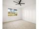 Bright, open bedroom with natural light, modern floors, and neutral white walls at 23503 Valderama Ln, Sorrento, FL 32776