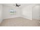 Open bedroom with tile flooring and natural light at 23503 Valderama Ln, Sorrento, FL 32776