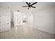 Open floor plan with stairs, white walls, and tile flooring at 23503 Valderama Ln, Sorrento, FL 32776