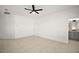 Spacious main bedroom with tile floors and an ensuite bathroom featuring a gray vanity at 23503 Valderama Ln, Sorrento, FL 32776