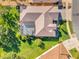 Aerial view of the property showcasing the screened lanai and manicured landscaping at 3530 Mulberry Grove Loop, Leesburg, FL 34748