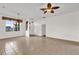 Spacious living room with neutral walls, tile flooring, and modern ceiling fans at 3530 Mulberry Grove Loop, Leesburg, FL 34748