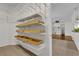 Well-organized pantry with wire shelving and wooden storage boxes offers ample storage space at 3530 Mulberry Grove Loop, Leesburg, FL 34748