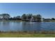 Scenic pond with a fountain, enhancing the community's tranquil ambiance on a clear day at 3530 Mulberry Grove Loop, Leesburg, FL 34748