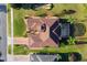 Bird's-eye view of house with brown roof and pool at 38728 Oak Place Ct, Lady Lake, FL 32159