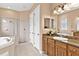 Elegant bathroom with a corner shower and a large vanity at 38728 Oak Place Ct, Lady Lake, FL 32159