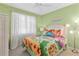 Bedroom with colorful bedding and cheerful decor at 38728 Oak Place Ct, Lady Lake, FL 32159