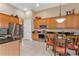 Kitchen with stainless steel appliances and light wood cabinets at 38728 Oak Place Ct, Lady Lake, FL 32159