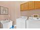 Laundry room with washer, dryer, and utility sink at 38728 Oak Place Ct, Lady Lake, FL 32159