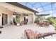 Spacious screened-in patio with seating areas, perfect for outdoor entertaining at 38728 Oak Place Ct, Lady Lake, FL 32159