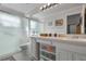 Clean bathroom with updated vanity, shower, and fixtures provide a comfortable and functional space at 4130 Capland Ave, Clermont, FL 34711