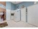 The kitchen offers ample storage, a modern refrigerator, and convenient access to other areas of the home at 4130 Capland Ave, Clermont, FL 34711