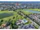 Aerial view showing location of home near golf course and pond at 1315 Greenville Way, The Villages, FL 32162