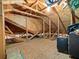 Unfinished attic space with wood framing and plywood at 1315 Greenville Way, The Villages, FL 32162