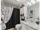 Clean bathroom with a shower/tub combo and updated vanity at 1315 Greenville Way, The Villages, FL 32162