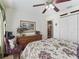 Cozy bedroom with a queen-size bed and built-in dresser at 1315 Greenville Way, The Villages, FL 32162