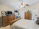 Bright bedroom with a queen-size bed and ample closet space at 1315 Greenville Way, The Villages, FL 32162