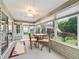 Comfortable sunroom with view of backyard and sliding doors at 1315 Greenville Way, The Villages, FL 32162