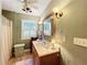 Charming bathroom with a wooden vanity and updated fixtures at 1415 E 9Th Ave, Mount Dora, FL 32757