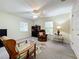 Charming bedroom with seating area and large windows at 1415 E 9Th Ave, Mount Dora, FL 32757