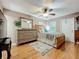 Bedroom with hardwood floors, ceiling fan and dresser at 1415 E 9Th Ave, Mount Dora, FL 32757