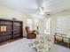 Relaxing bedroom with built-in shelving and seating area at 1415 E 9Th Ave, Mount Dora, FL 32757