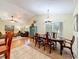 Elegant dining room with hardwood floors, chandelier, and wood dining set at 1415 E 9Th Ave, Mount Dora, FL 32757