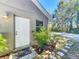 Exterior view of a small, white door with potted plants at 1415 E 9Th Ave, Mount Dora, FL 32757