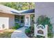 Welcoming front entrance with landscaping and a house number sign at 1415 E 9Th Ave, Mount Dora, FL 32757