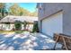 White garage door, driveway, and a wooden planter are visible at 1415 E 9Th Ave, Mount Dora, FL 32757