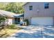 Front view of the house, showcasing the garage and entrance at 1415 E 9Th Ave, Mount Dora, FL 32757