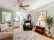 Cozy living room featuring comfortable seating and a view into the kitchen at 1415 E 9Th Ave, Mount Dora, FL 32757