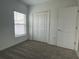 Bright bedroom with neutral carpeting and a double-door closet at 361 Singing Sands Cir, Lake Wales, FL 33859