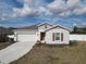 Newly constructed single-story home with a two-car garage at 361 Singing Sands Cir, Lake Wales, FL 33859