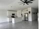 Modern kitchen with island, stainless steel appliances, and white cabinets at 361 Singing Sands Cir, Lake Wales, FL 33859