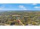 Aerial view of community highlighting mature trees and scenic landscapes at 1214 Loch Rannoch Ct, Leesburg, FL 34788