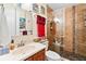 Updated bathroom with a glass enclosed tile shower and updated vanity at 1214 Loch Rannoch Ct, Leesburg, FL 34788