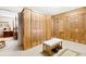 Spacious closet with bi-fold doors, overhead lighting, and additional clothing storage at 1214 Loch Rannoch Ct, Leesburg, FL 34788