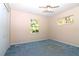 Standard bedroom with natural light, plain walls, a ceiling fan, and double closet at 21502 King Henry Ave, Leesburg, FL 34748