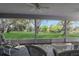 Screened lanai with views of the lush backyard, perfect for enjoying the outdoors at 21502 King Henry Ave, Leesburg, FL 34748
