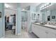 Bathroom featuring double sinks, a walk-in closet, and a toilet at 2354 Valhalla Dr, Tavares, FL 32778